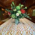 zig zag stripes on a printed tablecloth with flowers on it