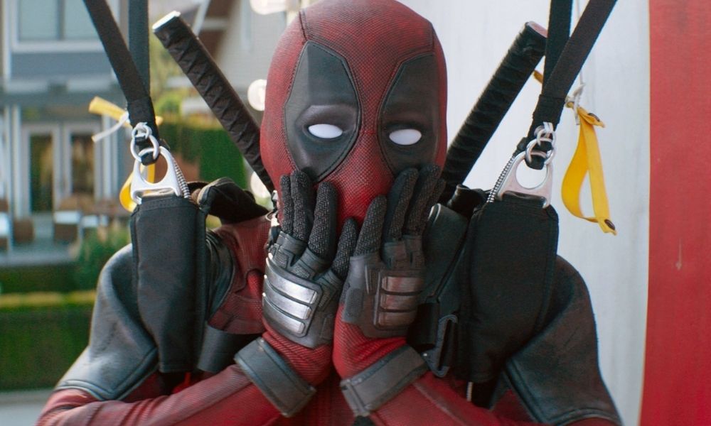 Deadpool from the Marvel movies, looking shocked with his hands on his face.