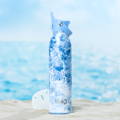 Swig Life 20z Flip + Sip Sea Spray Water Bottle on Sandy Beach with Ocean