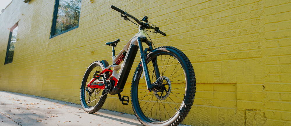 Cannondale Moterra electric mountain bike in front of yellow wall