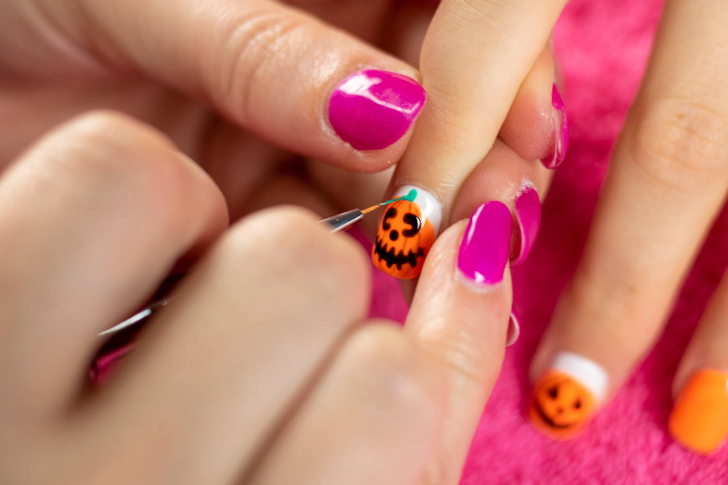 Pumpkin nails being finished with ORLY Hip & Outlandish stem detail