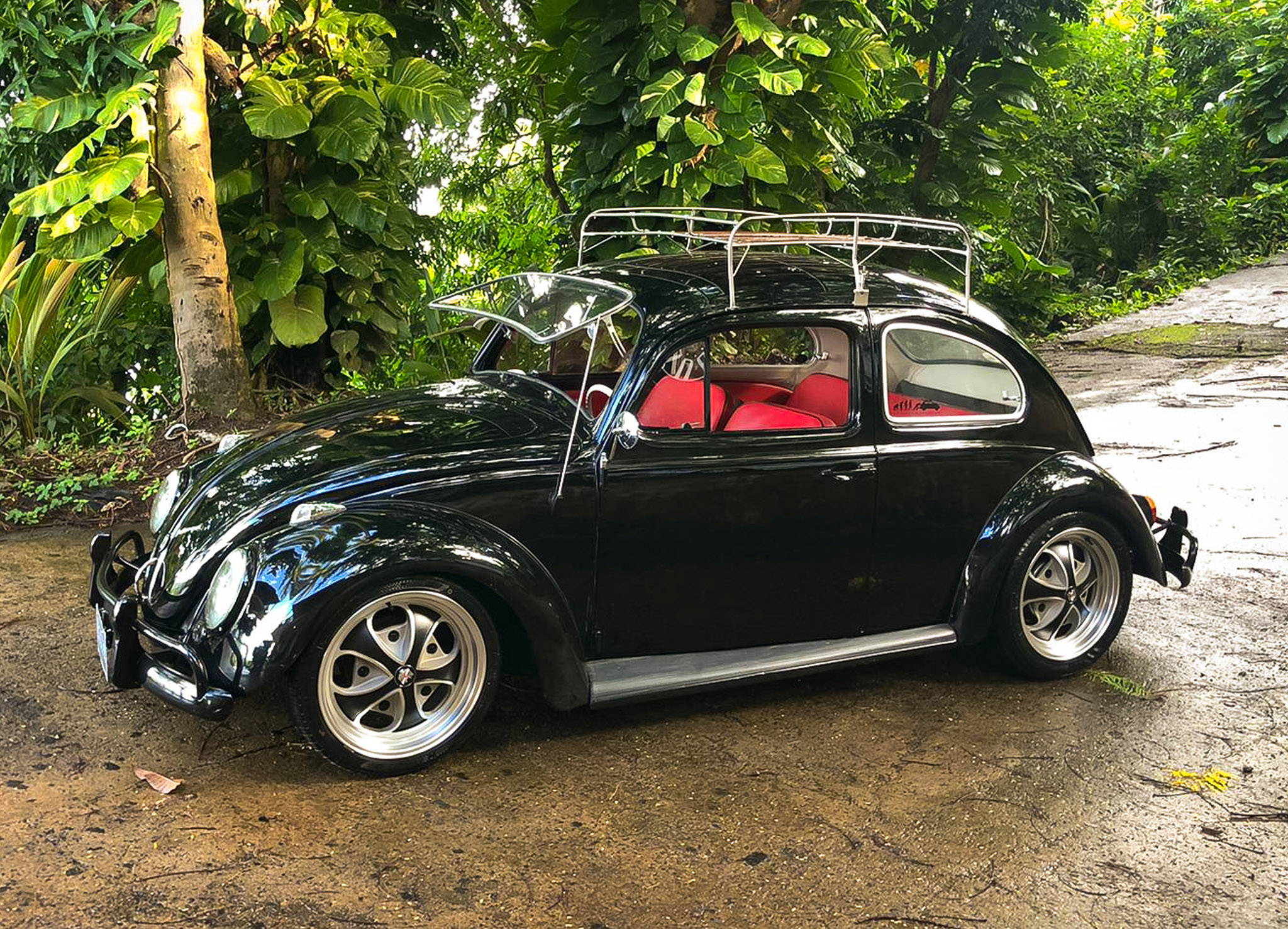 black volkswagen beetle on black machined with gray klassik rader falcon wheels