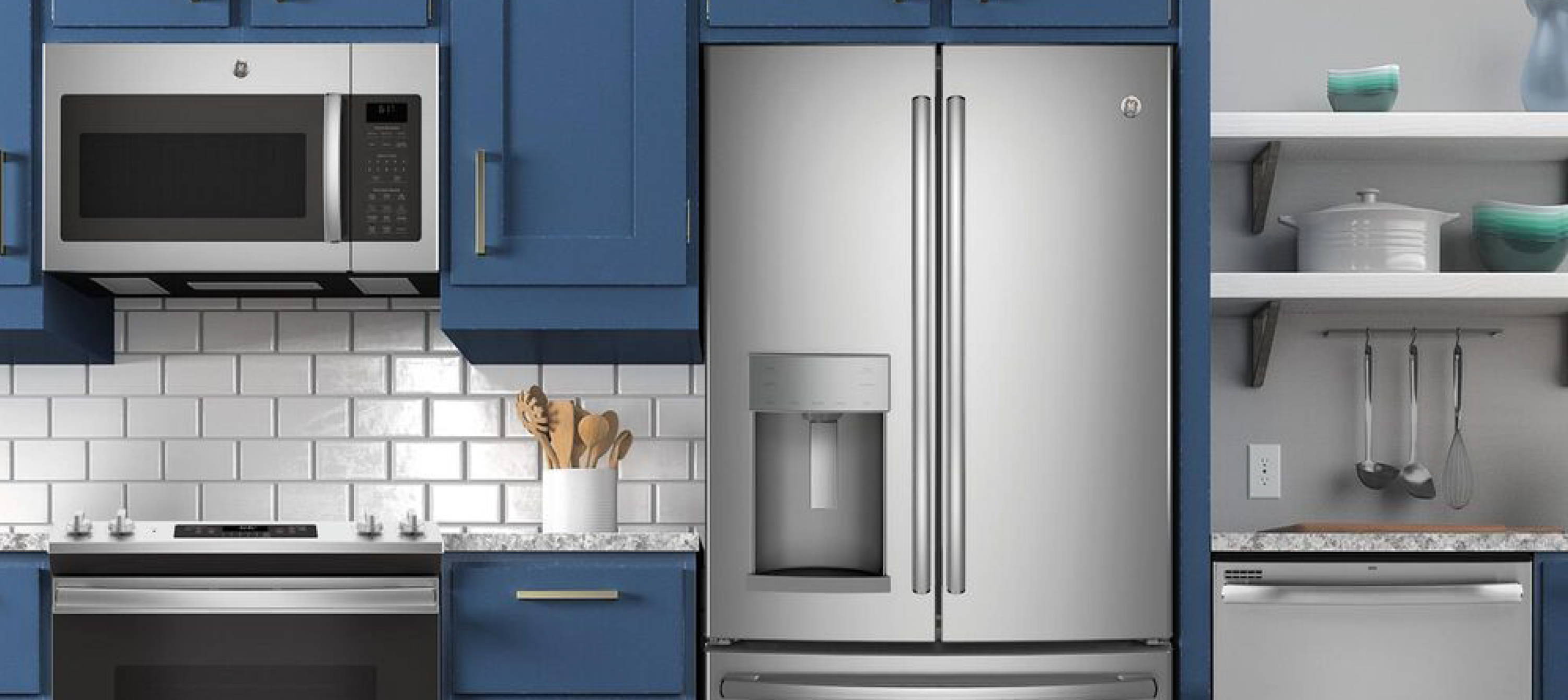 Kitchen scene featuring a range, microwave, refrigerator, and dishwasher. Click the "Shop Appliances" button to be directed to our in-stock appliances collection.