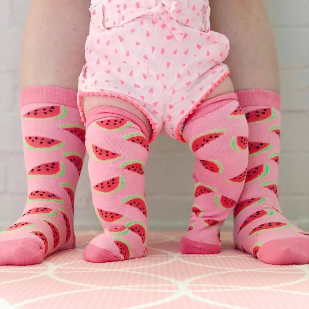 Baby and child in socks for Individual fundraiser for cuddle cots.