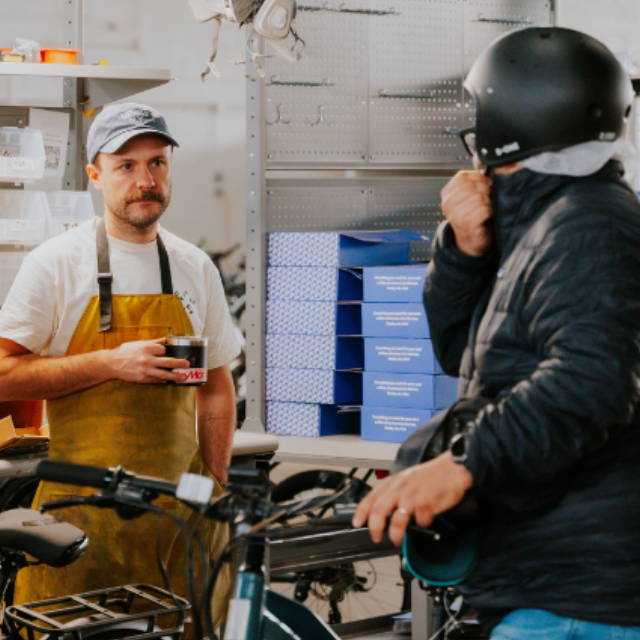 two people in a bike shop