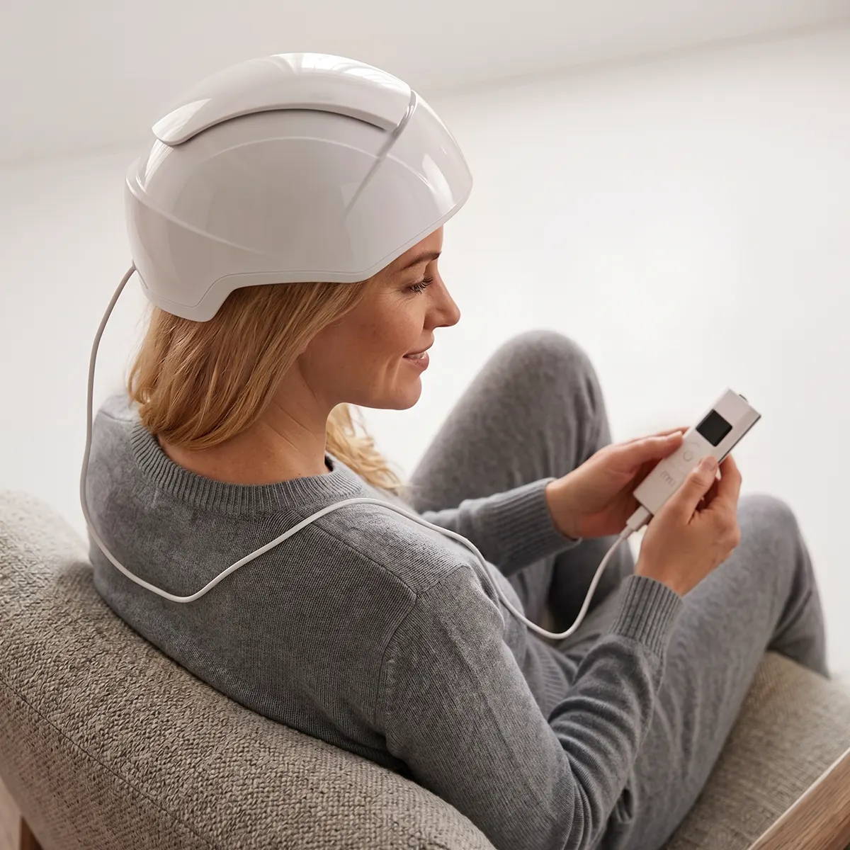 Laser hair growth helmet with external battery