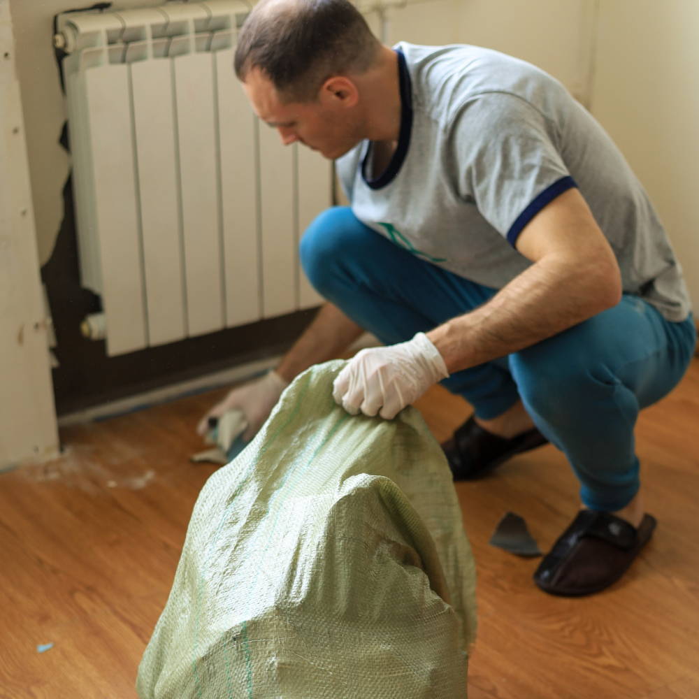 Man cleaning inside his house, remodeling house