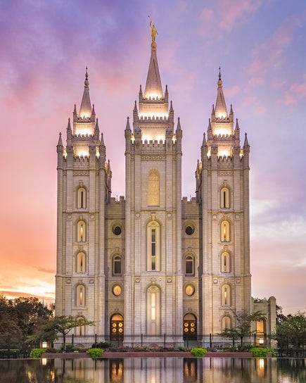 Salt Lake Temple glowing against a pastel sky.