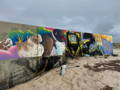 cleaning graffiti from a mural
