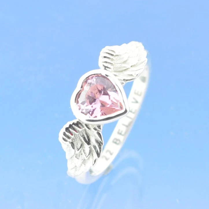 memorial jewellery ring. a heart stones between angel's wings.