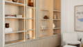 Havit LED strip lighting integrated into timber built-in shelving, casting a warm glow across styled shelves and stone surfaces