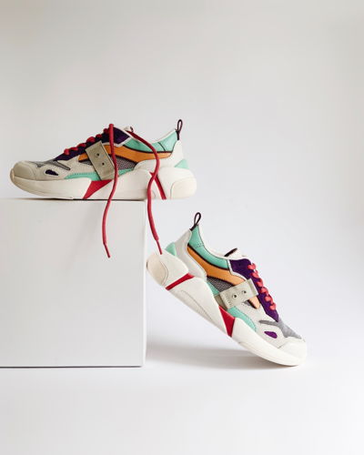 Two colorful sneakers on a box