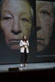 Eve Merinville having a speech on stage