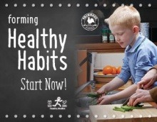 Healthy habits poster featuring a young boy helping his mother for dinner by washing vegetables