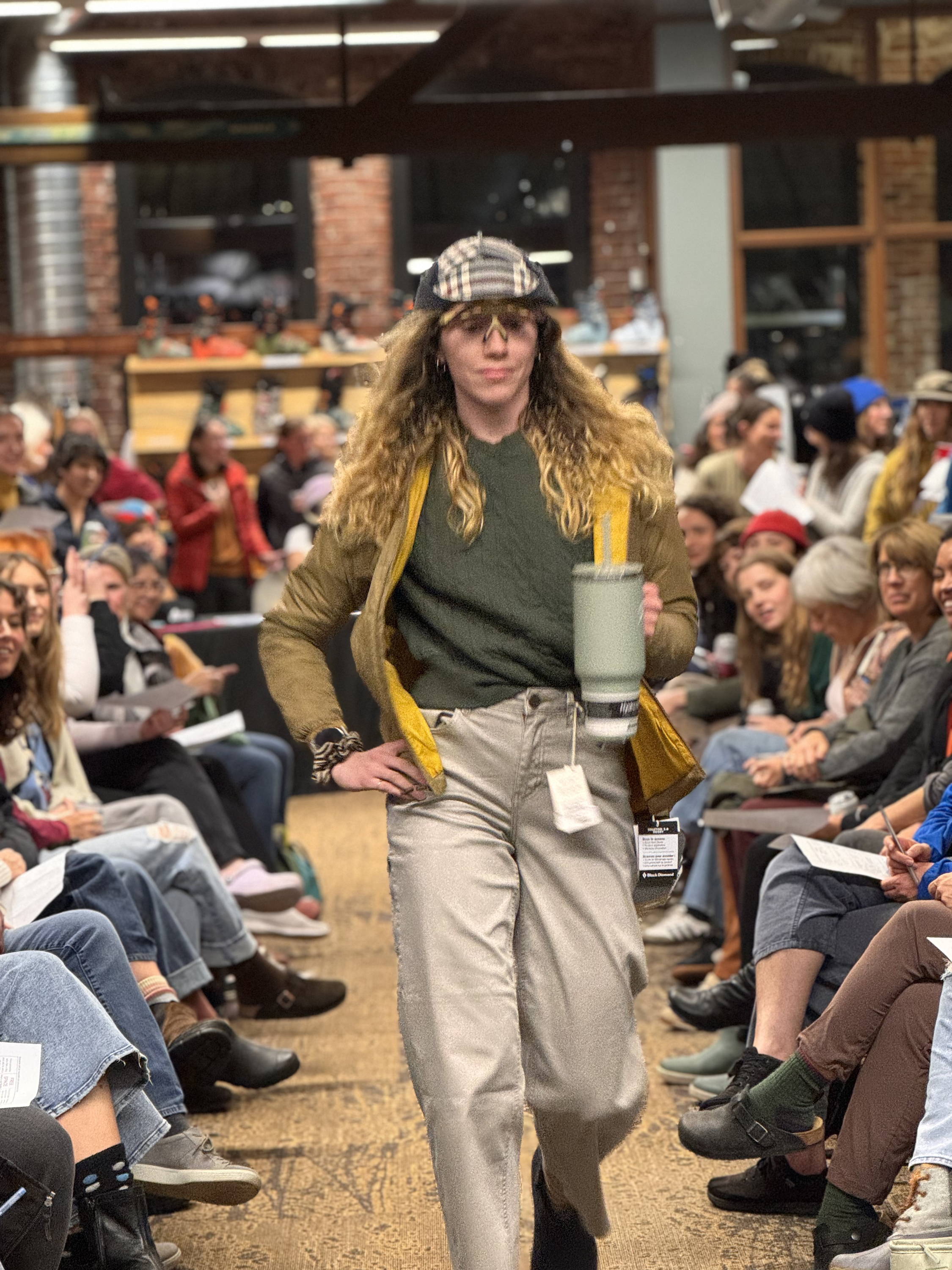 A large group gathers for an event at the shop.