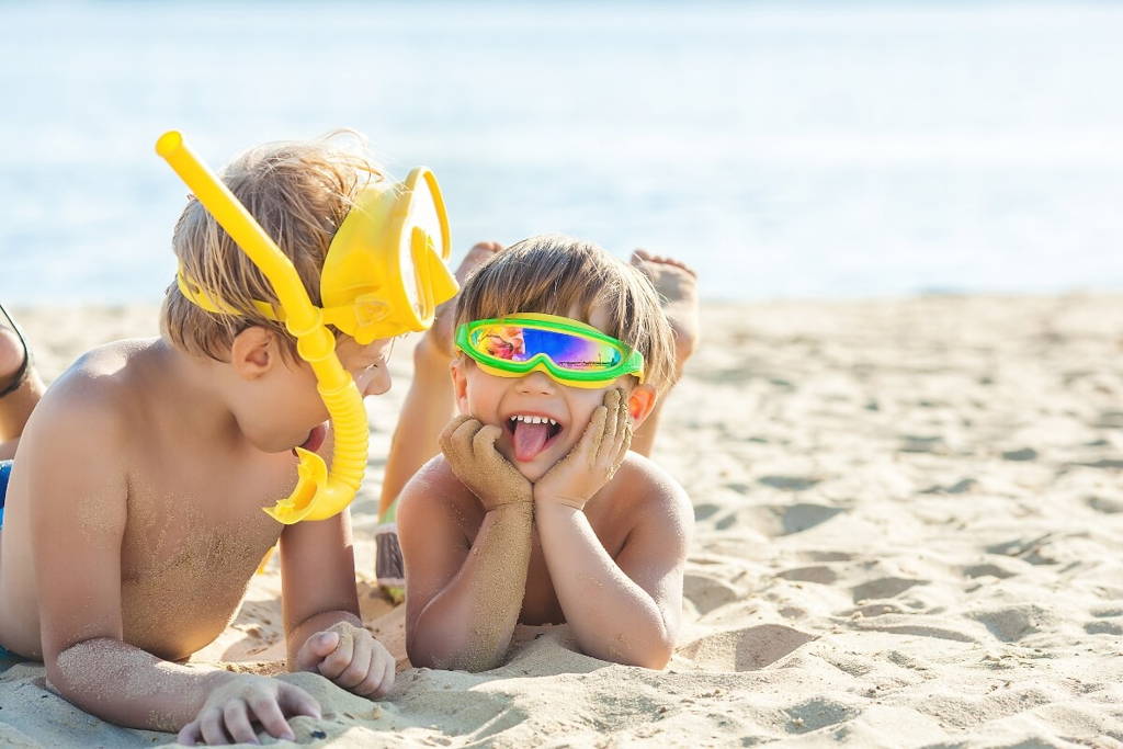 Little brothers enjoying a day at the beach.