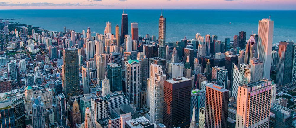 Photo by Aveedibya Dey on Unsplash of Chicago Skyline from drone Sign
