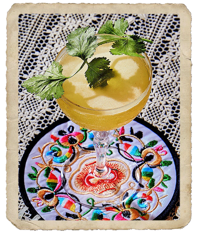 Glass with the yellow colored prepared Amoroso cocktail.