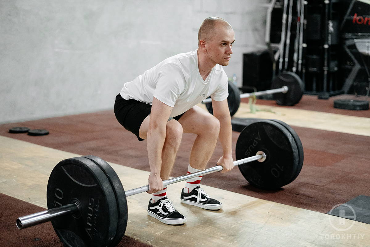 Powerlifter with a Barbell Wearing Flat Shoes for Lifting