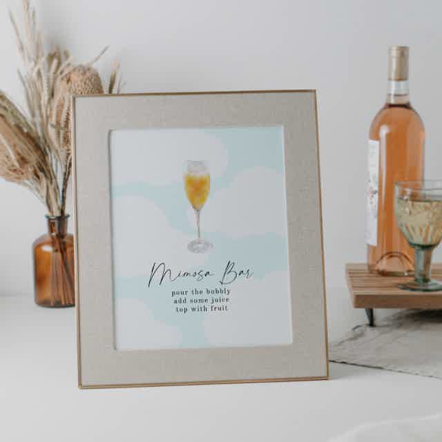 Cloud 9 bridal shower mimosa bar sign: light blue backdrop, modern calligraphy font, serif font. Perfect for your special event!