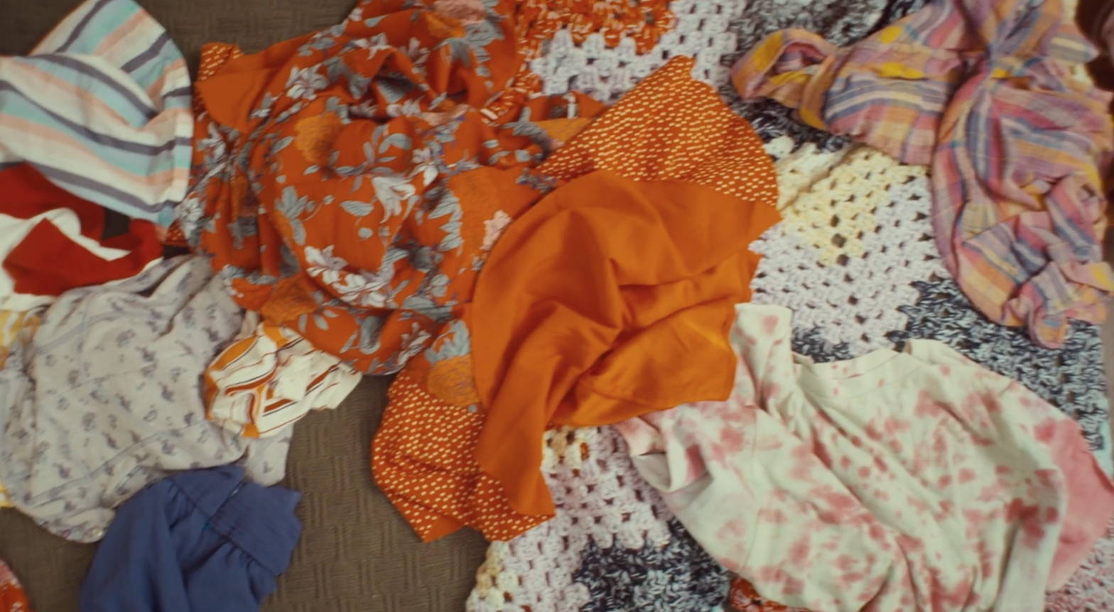 1970s clothes lying on floor in a messy way