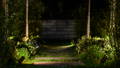 Carefully positioned garden spike lights guide the pathway with soft layered illumination, creating depth and atmosphere throughout the outdoor space by Havit Lighting.