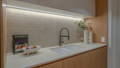 Butler's Pantry / Scullery Havit LED strip under overhead cabinetry illuminating tiled splashback and stone benchtop with undermount sink, Manly QLD