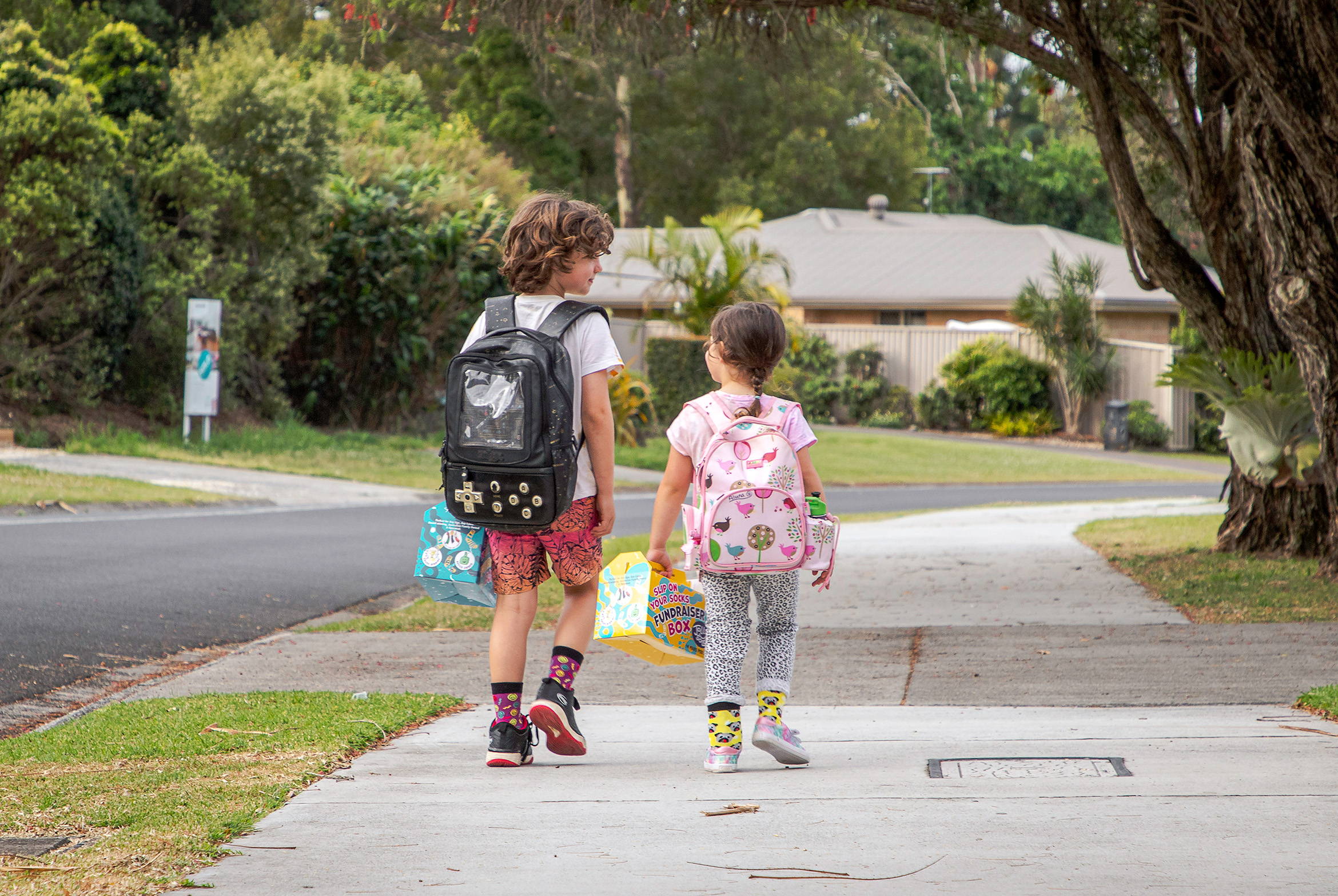 Kids walking with the fundraising boxes for School fundraising in Australia