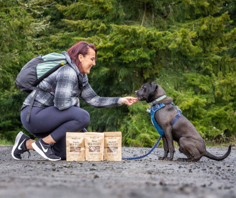 A picky dog eating a bowl of Rosie's Beef N' Rice dog food meal mixers.