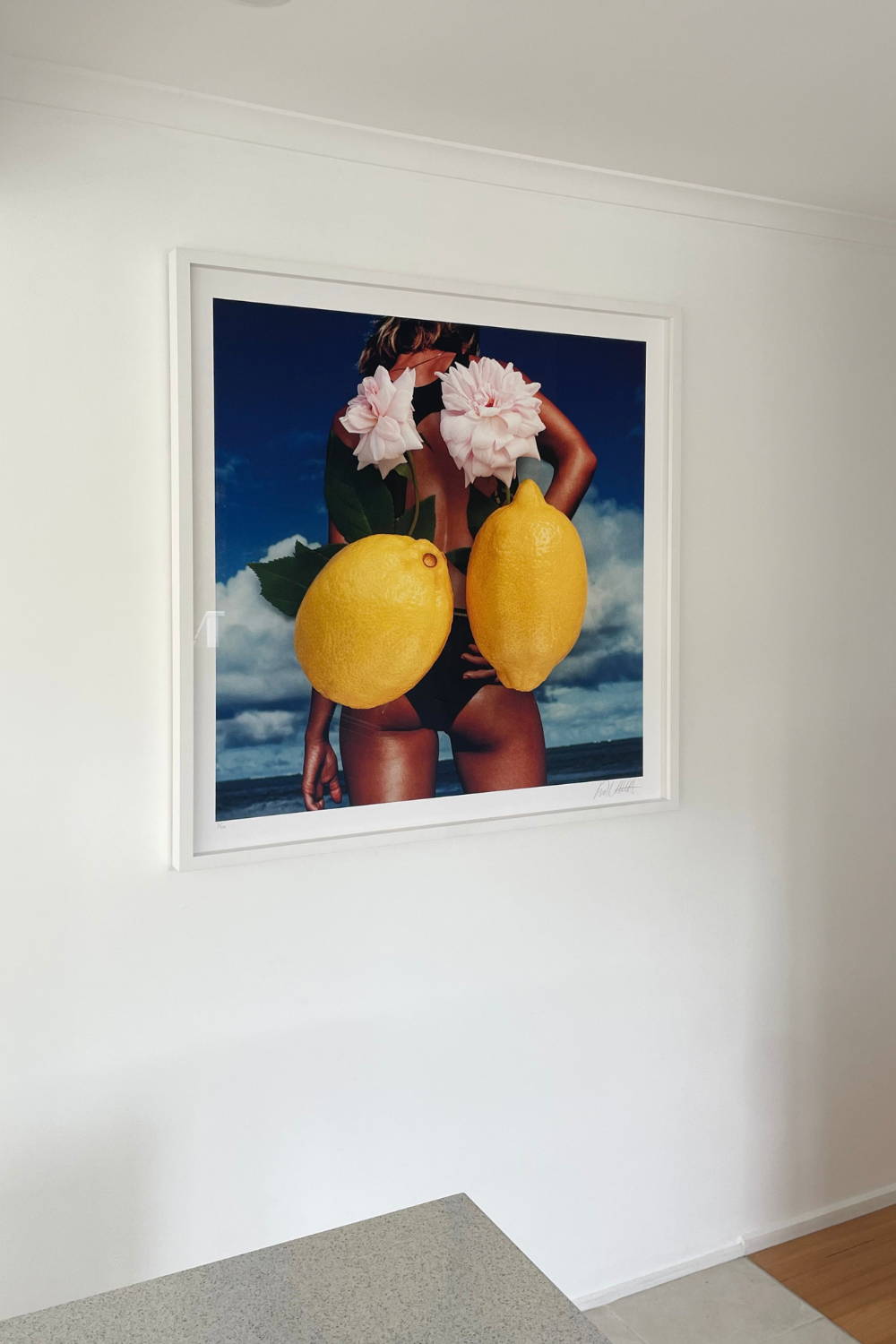 'Beach Bum' by Dina Broadhurst - A colourful photographic print of a lady at the beach, embellished with collage flowers and lemons.