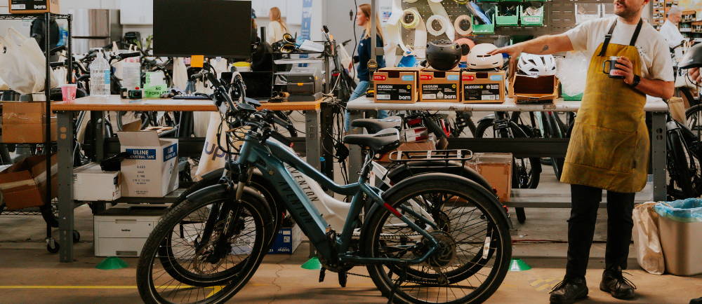 Aventon electric bikes in front of Upcenter work benches