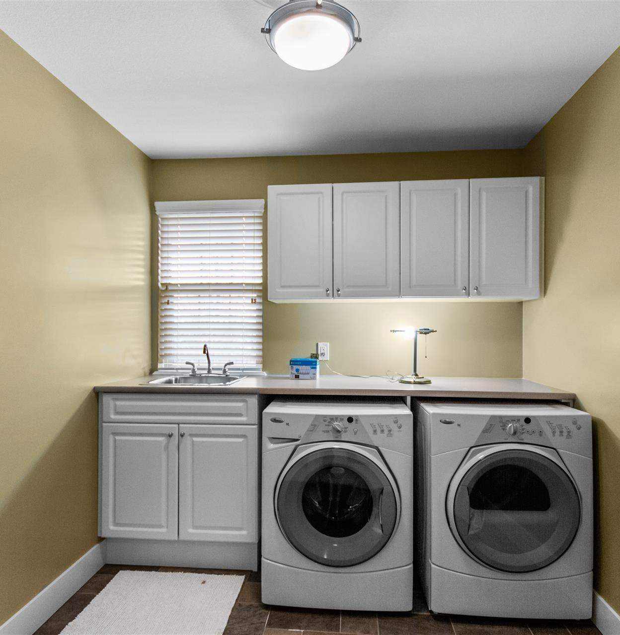 clothes washing area with natural light and independent washer and dryer