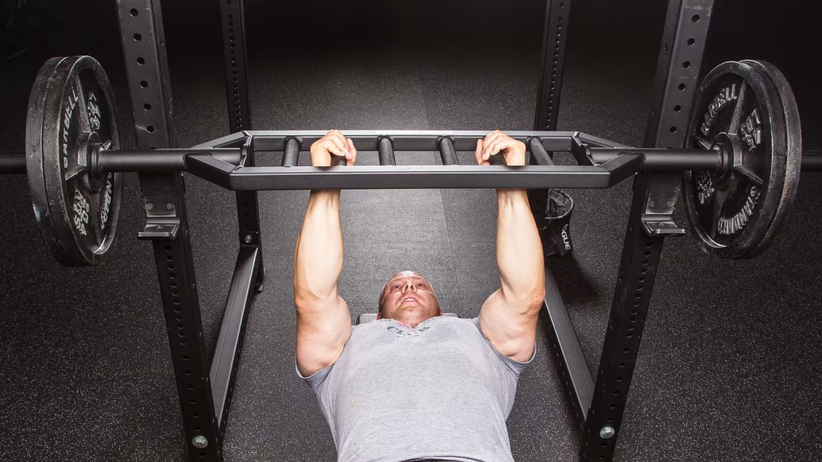 Man doing an exercise Rogue MG-1 Multi Grip Bar