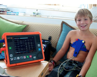 Jake demonstrates the boat's portable EKG.