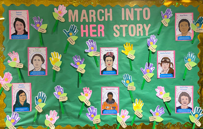 bulletin board decorated with influential women in the world 