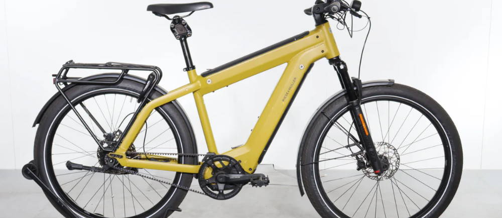 A yellow Riese & Müller Supercharger GT Rohloff HS electric touring bike