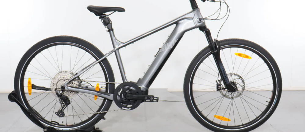 a silver Cannondale Tesoro Neo X Speed electric city bike