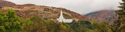 Panoramic photo of the Bountiful Temple nestled in the hills.