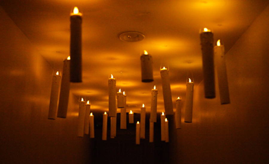 candles floating in a hallway
