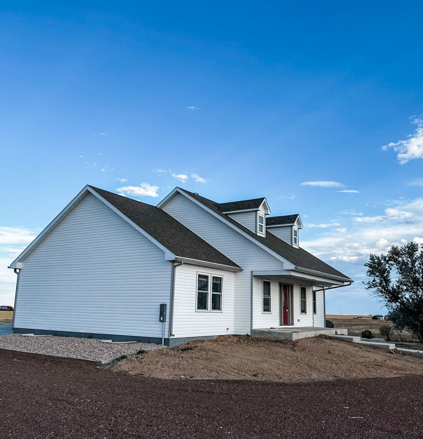 back of property with a water view