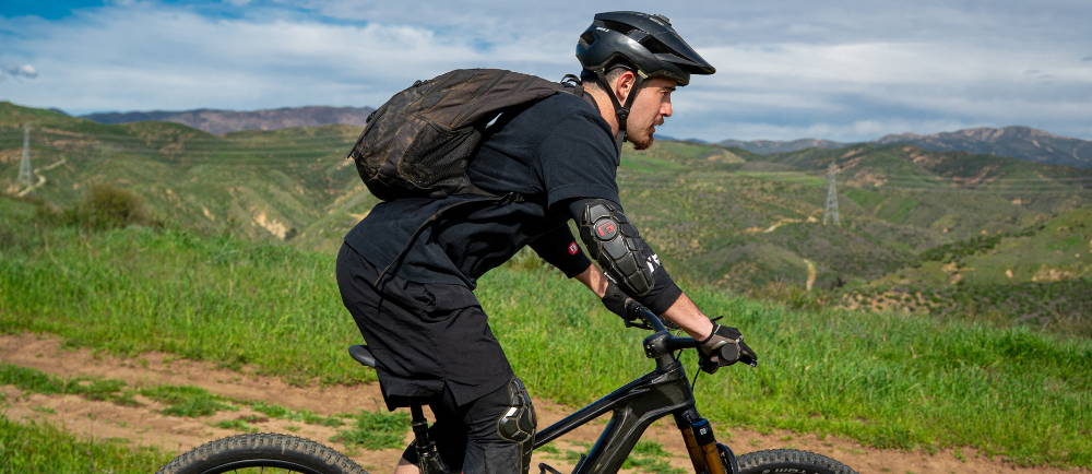 Rider with backpack on Giant electric mountain bike