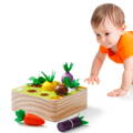Little boy crawling and looking towards Montessori Vegetable Set toy. 
