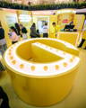 Garnier product display featuring integrated Havit Lighting LED strip around the curved counter.