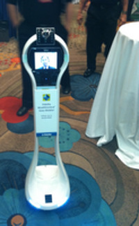 Fidelity's VGo, a four-foot-tall robot on wheels, sporting the live image of Fidelity's applied technology head, Al Lee, was one of the stars of the T3 gathering.