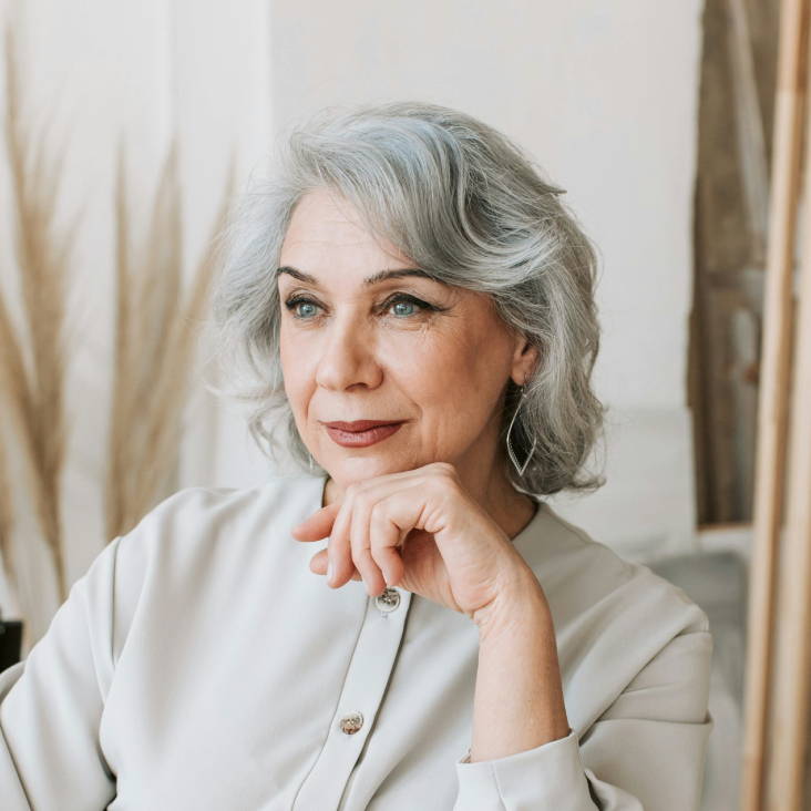 woman with grey short hair that has waves and elegant face framing pieces