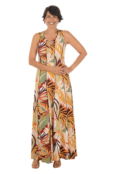 A woman wears a bold jungle sleeveless maxi dress.
