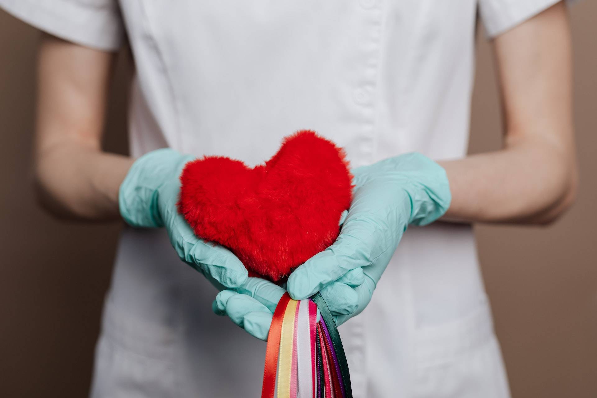 heart in hands of a nurse, clean water is essential