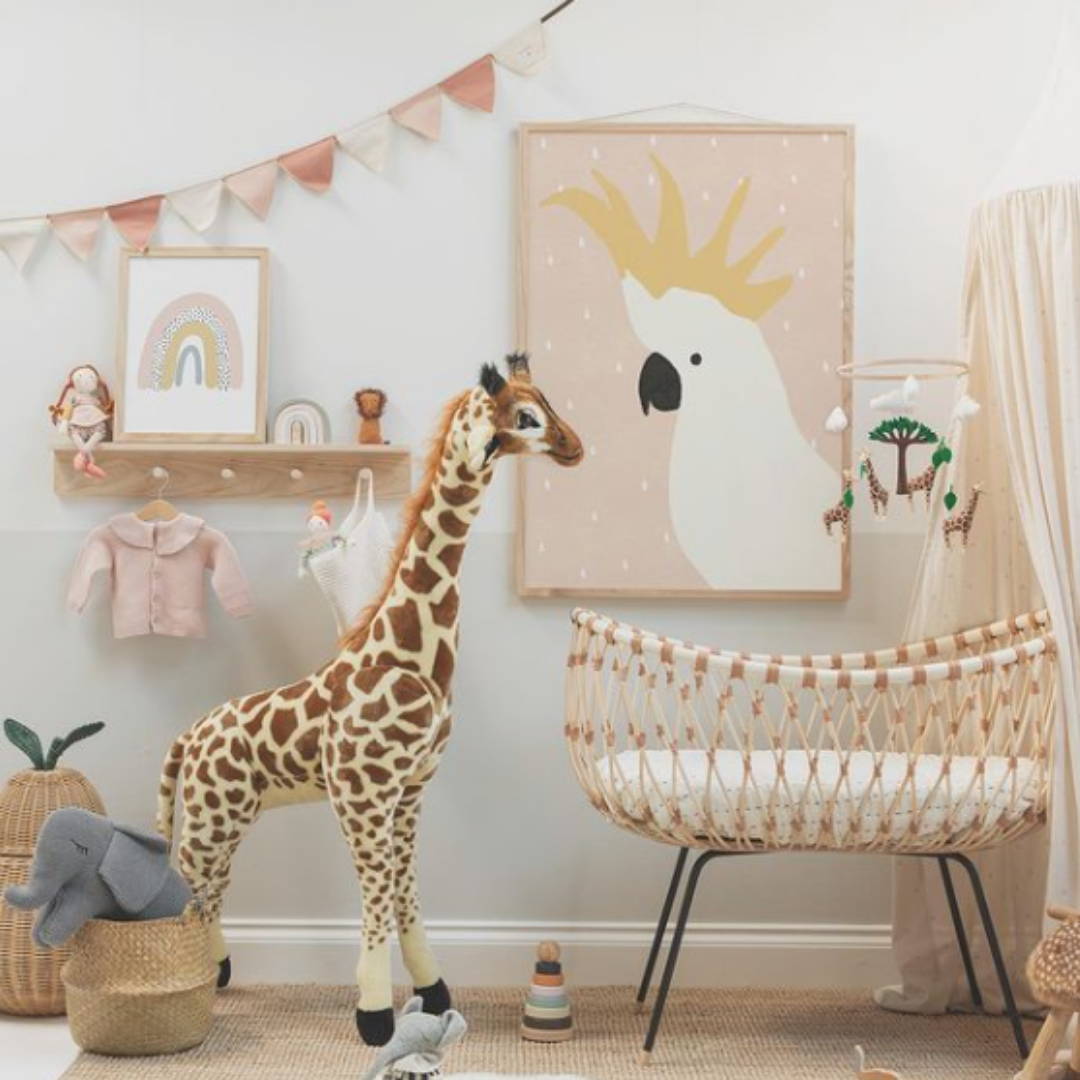 safari themed neutral nursery with crib, storage and giraffe