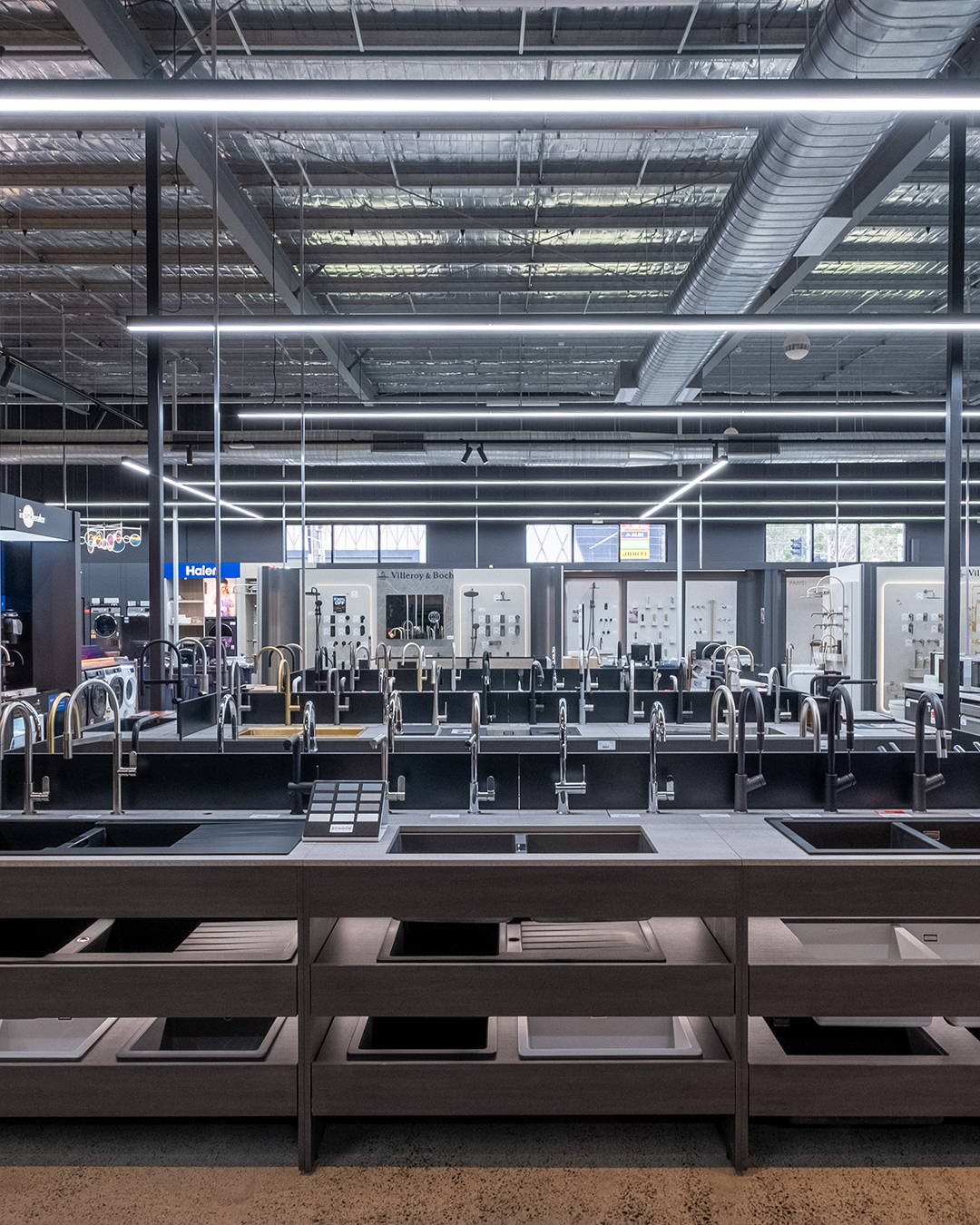 Feature lighting design using minimalist pendant fittings to complement the clean lines of the retail environment. Track Lighting & Pendant Lighting by Havit Commercial, the commercial range of Havit Lighting