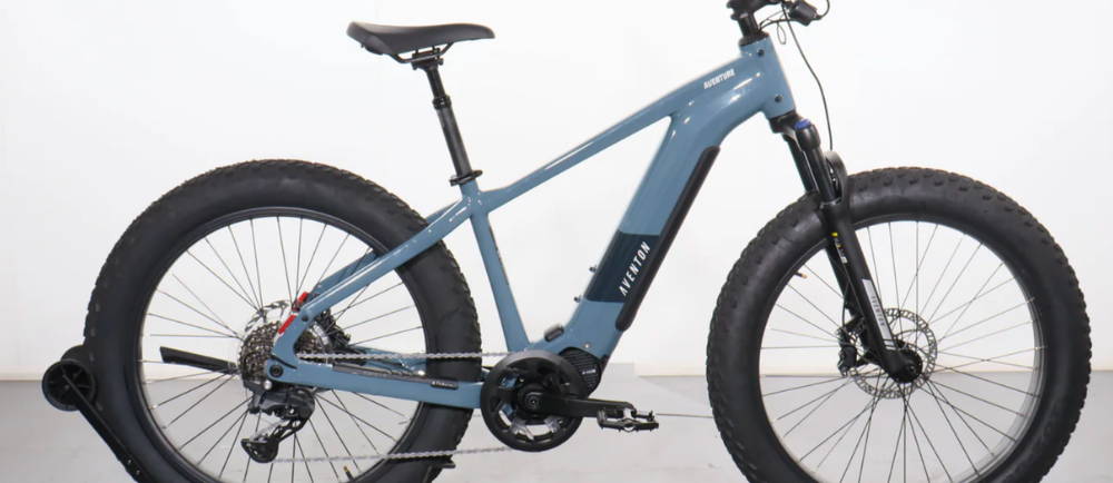 a blue Aventon Aventure M fat tire electric mountain bike
